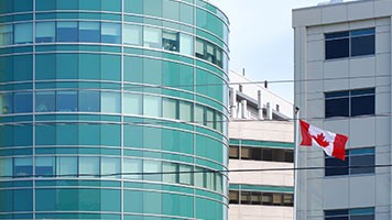 Office  with a Canadian flag in the foreground